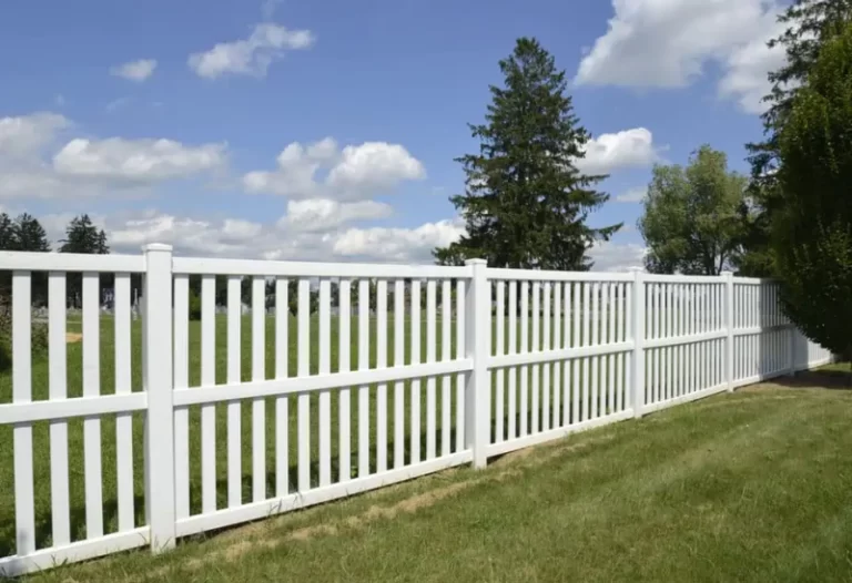 The Best Way to Trim Grass Around a Vinyl Fence